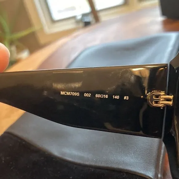 MCM NEW MCM 709S 002 Black Sunglasses With Anniversary Print On Temple